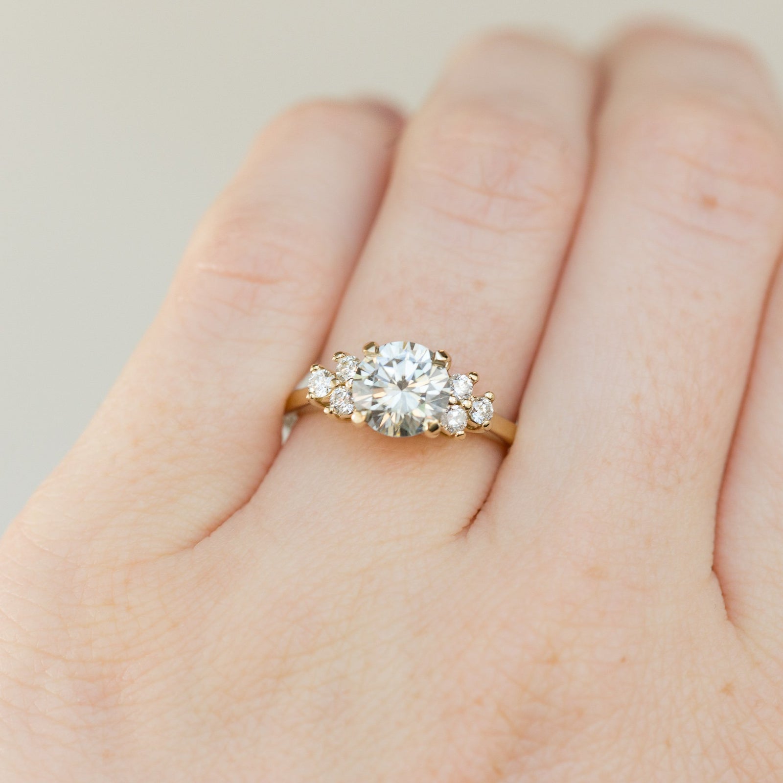 Side cluster engagement ring discount