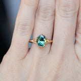2.40ct Oval Teal Green Parti Sapphire Evergreen Carved Split Shank Six Prong Ring in 14k Yellow Gold on hand