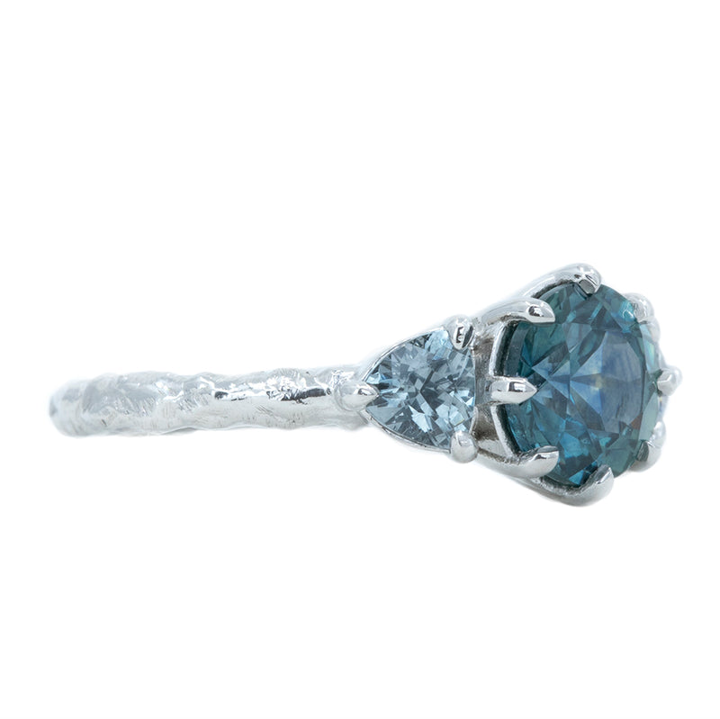 1.80ct Blue Montana Sapphire and Grey Spinel Three Stone Low Profile Evergreen Ring in Platinum side view