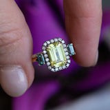 2.62ct Emerald Cut Nigerian Sapphire and Montana Sapphire Low Profile Scallop Cut Three Stone Ring with Antiqued Diamond Halo in 18k Yellow Gold