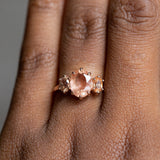 1.45ct Oval Sunstone Three Stone Antique Low Profile Ring in 14k Rose Gold on the hand