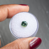 1.29CT ROUND BRILLIANT SONGEA SAPPHIRE, SPRING GREEN WITH TEAL, 6.44X4.22M, UNHEATED