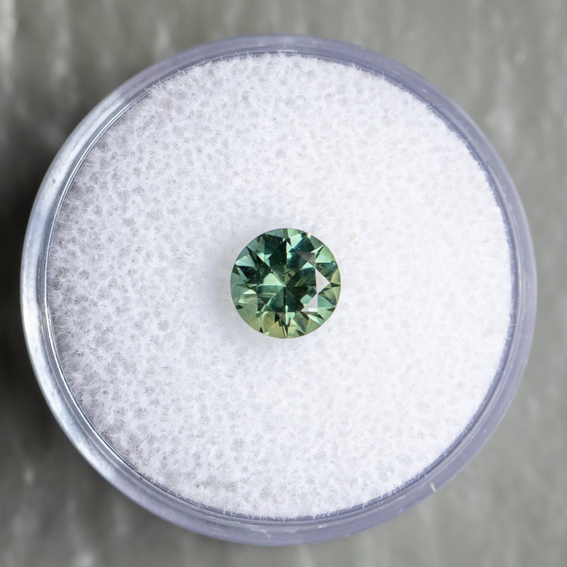 1.29CT ROUND BRILLIANT SONGEA SAPPHIRE, SPRING GREEN WITH TEAL, 6.44X4.22M, UNHEATED