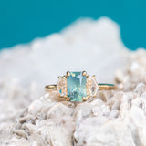 1.47ct Radiant Opalescent Teal Sapphire and White Sapphire Three Stone Ring in 14k Yellow Gold