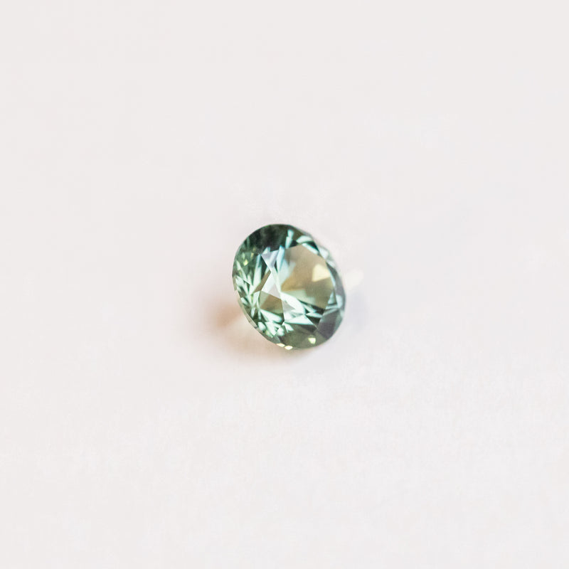 1.50CT ROUND PRECISION CUT MONTANA SAPPHIRE, LIGHT TEAL GREEN BLUE, 6.80X4.49MM