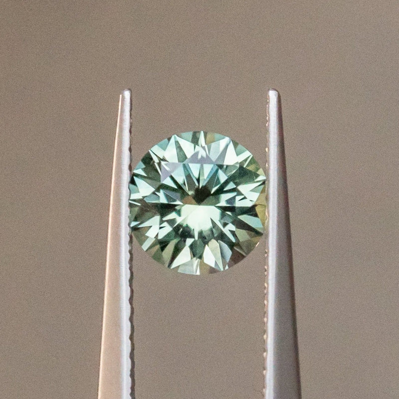 1.50CT ROUND PRECISION CUT MONTANA SAPPHIRE, LIGHT TEAL GREEN BLUE, 6.80X4.49MM