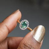 1.20ct Silky Oval Green Madagascar Sapphire and Diamond Four Prong Halo Ring in 14K White Gold Halo and 14k Yellow Gold Shank