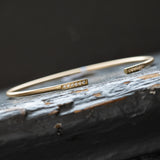 Flexi-Bangle with diamonds in satin finished solid 14k white and yellow gold
