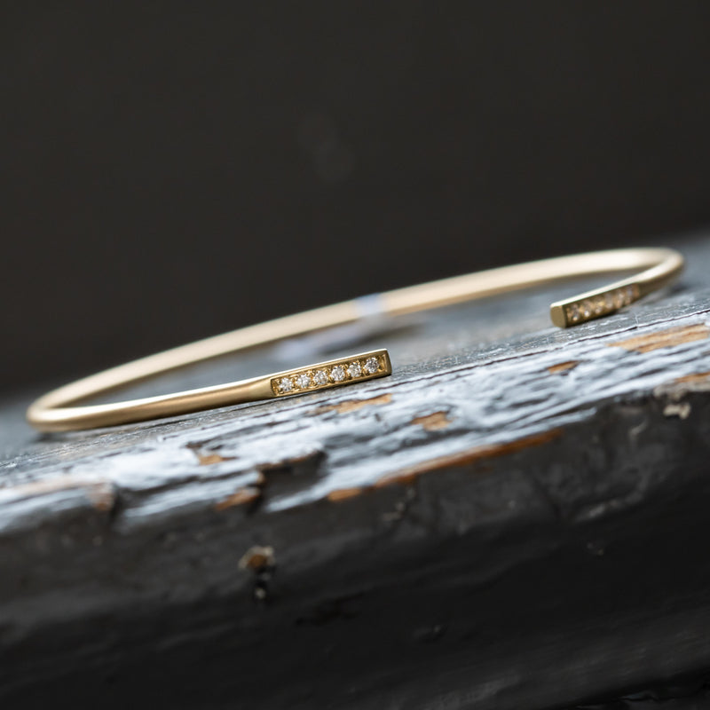 Flexi-Bangle with diamonds in satin finished solid 14k white and yellow gold