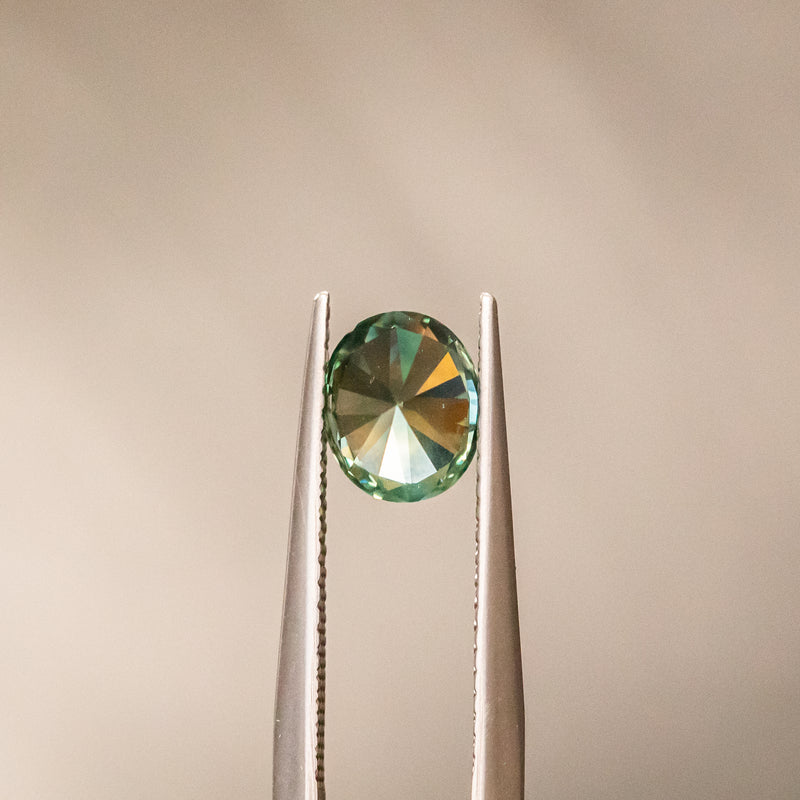 1.52CT OVAL PRECISION CUT MONTANA SAPPHIRE, LIGHT TEAL GREEN, 7.19X6.02MM