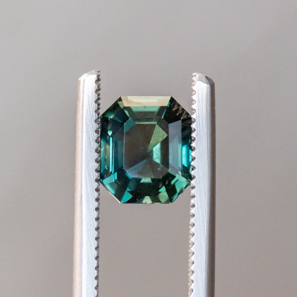 2.06CT EMERALD CUT MADAGASCAR SAPPHIRE, COLOR CHANGING DEEP TEAL TO PURPLE GREY, 7.4X6.32X4.28MM, UNTREATED