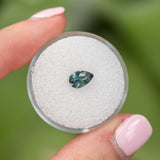 0.74CT PEAR SAPPHIRE, SILKY TEAL WITH ORANGE INCLUSION, 7.43X4.9MM