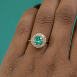 0.94ct Round Neon Green Emerald With Bezel Set Diamond Halo In 18k Yellow Gold