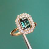 2.05ct Emerald cut Sapphire With Bezel Set Diamond Halo In 14k Yellow Gold