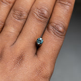 0.83CT ROUND BRILLIANT SONGEA SAPPHIRE, DENIM BLUE WITH BRIGHT TEAL FLASHES, 5.60X3.70MM