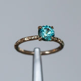 1.39ct Round Teal Songean Sapphire Evergreen Solitaire in Recycled 14k Yellow Gold