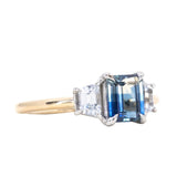 1.28ct Emerald cut Tanzanian Ombre Sapphire and Cadillac cut White Sapphire Low Profile Three Stone Ring in Platinum and 14k Yellow Gold