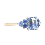 2.02ct Emerald Cut Bicolor Sapphire and Blue Sapphire Side Stone Cluster Ring in Two Tone 14k Yellow and White Gold