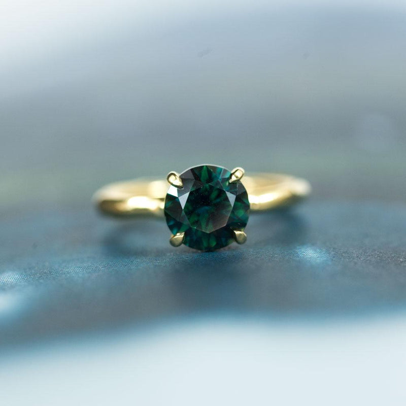 2.66 round deep teal blue green sapphire Alluvial solitaire ring in 18k yellow gold