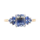 2.02ct Emerald Cut Bicolor Sapphire and Blue Sapphire Side Stone Cluster Ring in Two Tone 14k Yellow and White Gold