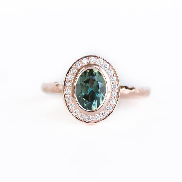 Oval Bezel Set 1.49ct Color Changing Teal Sapphire and Diamond Halo Engagement Ring - 14k Rose Gold Evergreen Band