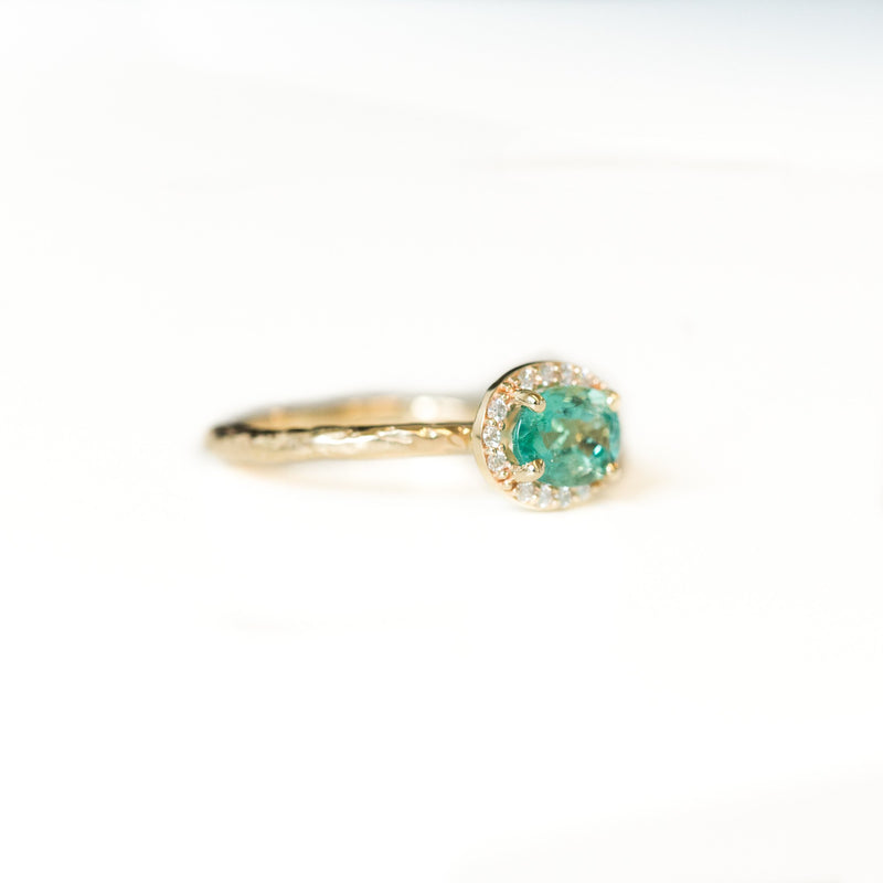 Neon Emerald East-West Oval Halo Ring in Evergreen Carved Yellow Gold