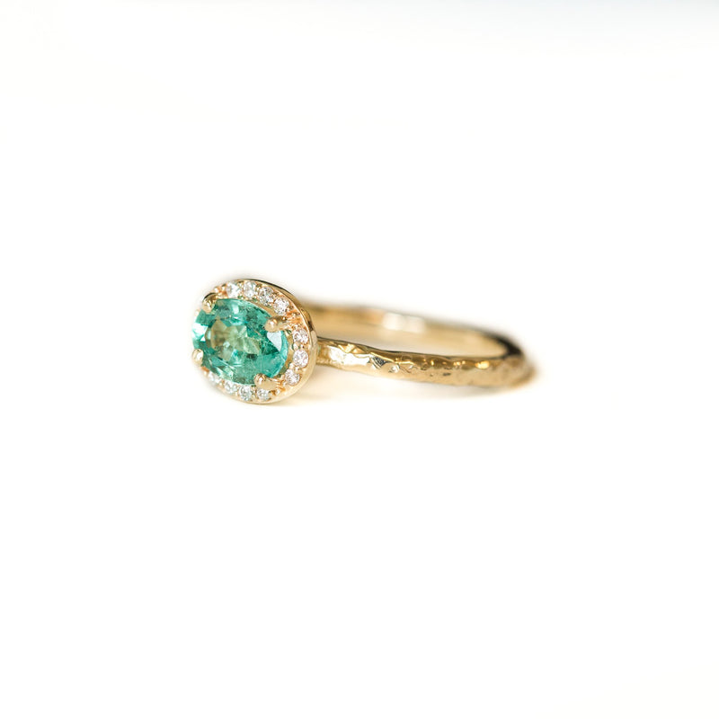 Neon Emerald East-West Oval Halo Ring in Evergreen Carved Yellow Gold