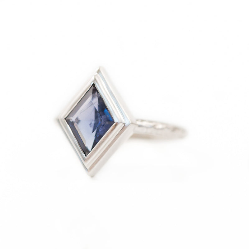 Kite Shaped Purple Blue Iolite in Evergreen Carved 18k White Bezel with satin finish