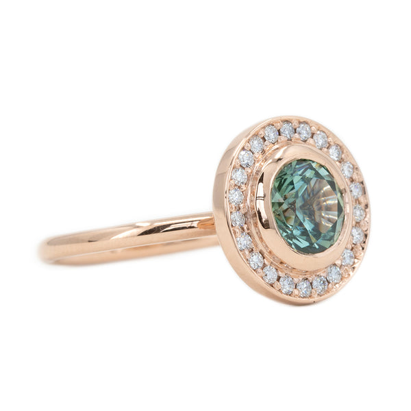 1.95ct Teal Montana Sapphire With Bezel Set Diamond Halo In 14k Rose Gold side angle