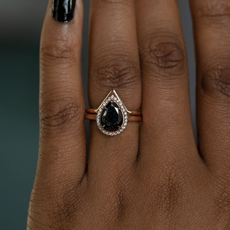 2.44ct Black Pear Diamond in 14k Rose Gold Diamond Halo Setting on hand with v band