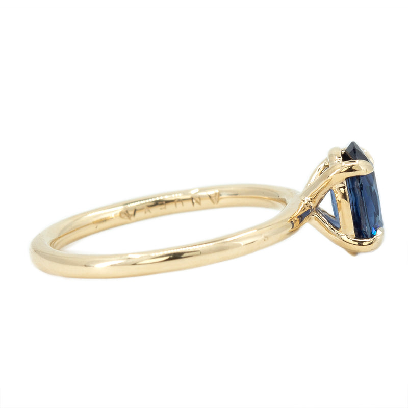 1.53ct Oval Royal Blue Sapphire Solitaire Ring In 14K Yellow Gold side angle