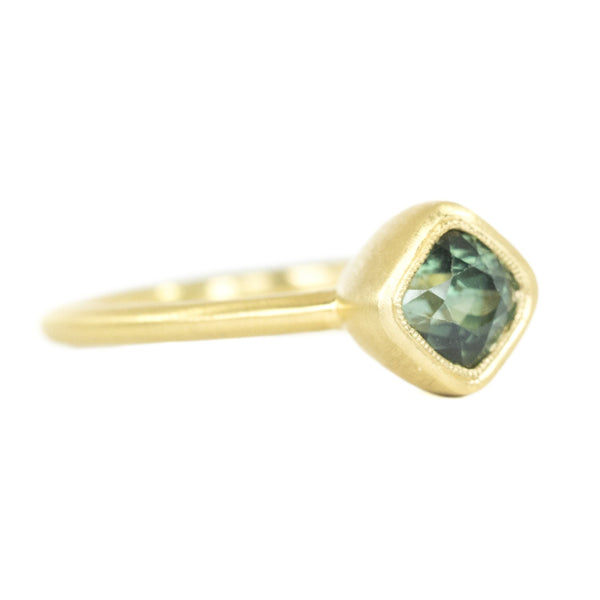 1.56ct Cushion Cut Sapphire With Milgrain Bezel Set In 18k Yellow Gold Brushed Finish side view
