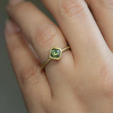 1.56ct Cushion Cut Sapphire With Milgrain Bezel Set In 18k Yellow Gold Brushed Finish on hand