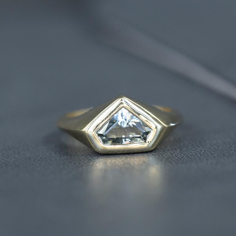 1.88ct Shield Montana Sapphire Signet Ring in 14k Yellow Gold on table