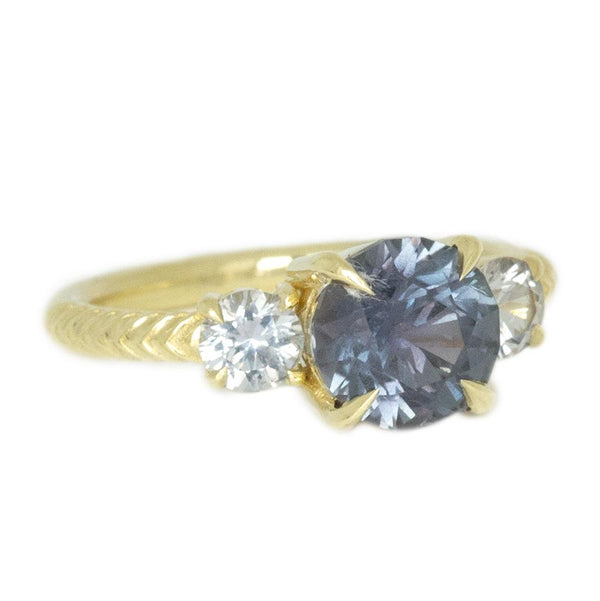 2.31ct GIA Greyish Purple Montana Sapphire Three Stone Ring with Chevron Texture in 18k Yellow Gold side angle