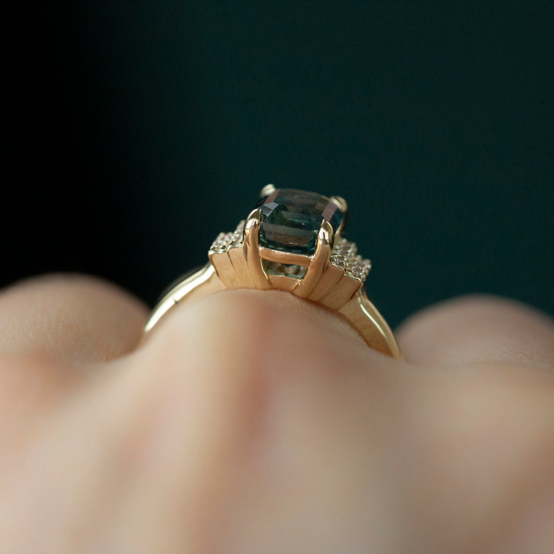 2.57ct GIA Emerald Cut Teal Blue Montana Sapphire and Diamond Ring in 14k Yellow Gold on hand2.57ct GIA Emerald Cut Teal Blue Color Shifting Montana Sapphire and Diamond Ring in 14k Yellow Gold