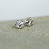 1.40ctw Salt And Pepper Diamond Stud Earrings in 6 Prong Settings In 14k White Gold on table