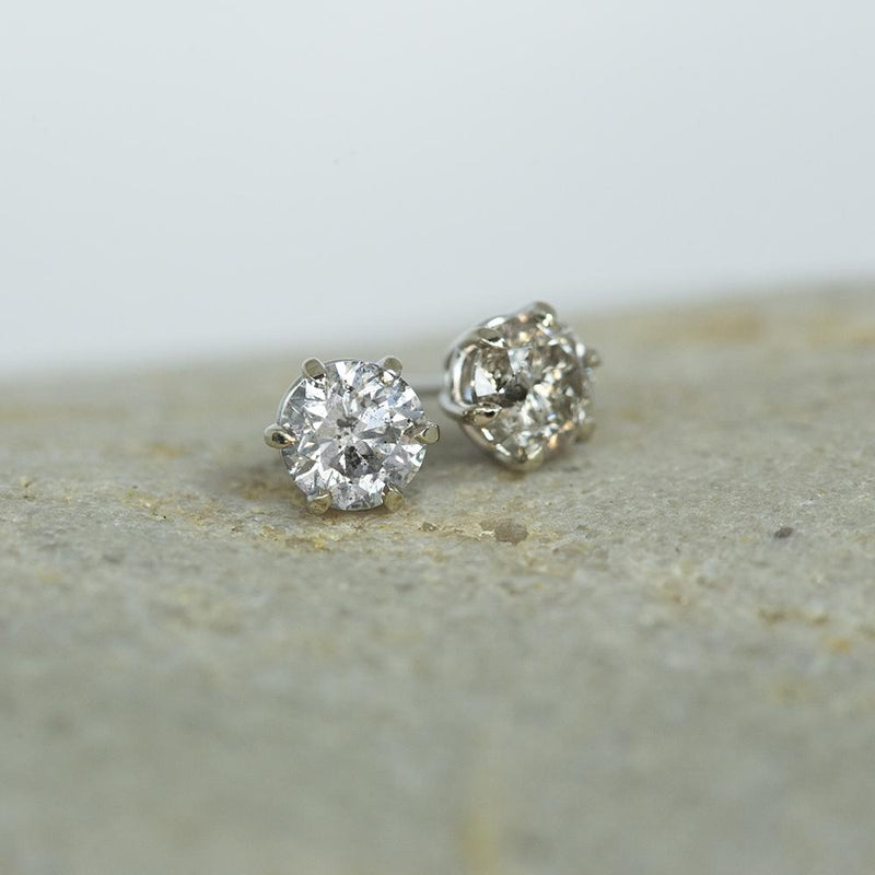 1.40ctw Salt And Pepper Diamond Stud Earrings in 6 Prong Settings In 14k White Gold on table
