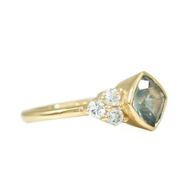Minty Cushion Cut Sapphire Ring with Diamond Cluster Side Stones in Bezel Yellow Gold