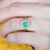 1.33ct Round Emerald in Evergreen 18K Yellow Gold Low Profile Diamond Halo Ring