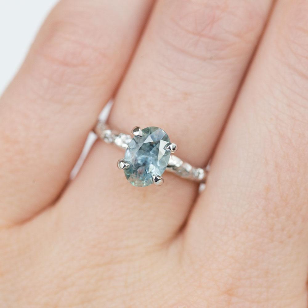 Oval Icy Blue Montana Sapphire Ring with Embedded Diamonds