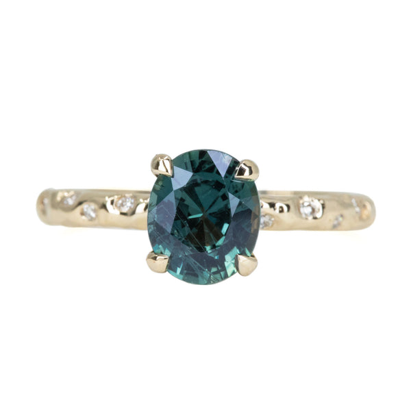 1.79ct Oval Blue Color Changing Sapphire in 14k Yellow Gold Evergreen Solitaire with Scattered Embedded Diamonds