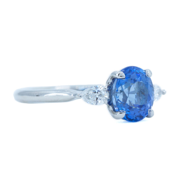 1.87ct Oval Blue Sapphire and Pear Diamond Three Stone Ring in Platinum