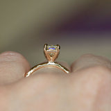 1.30ct Light Champagne Emerald Cut Diamond Solitaire Evergreen Ring In 14k Yellow Gold profile shot on hand