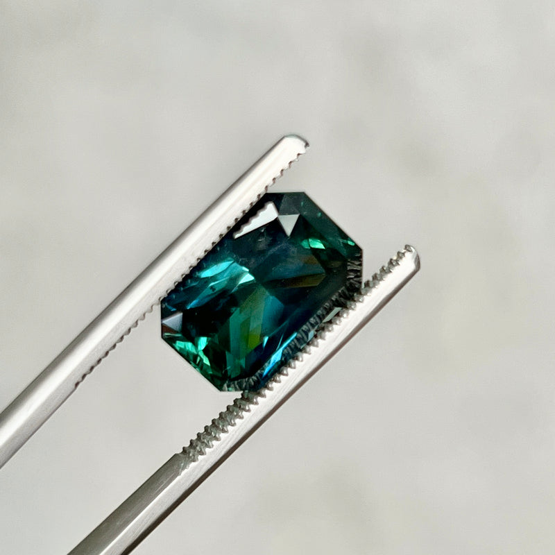 6.60CT RADIANT CUT MADAGASCAR SAPPHIRE, DEEP GREEN TEAL WITH FLASHES OF ROYAL BLUE , 6.60X8.55X6.16MM