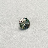 1.17CT BRILLIANT ROUND MADAGASCAR SAPPHIRE, COLOR SHIFTING TEAL TO PURPLE RED WITH OLIVE GREEN FLASHES, 6.65X3.70MM