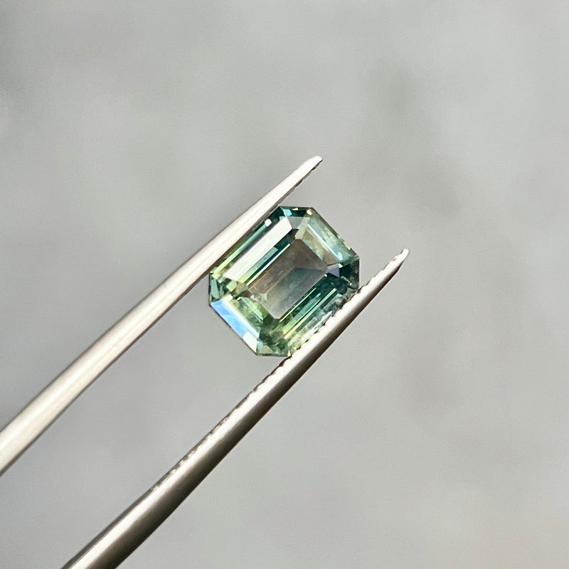 2.15CT EMERALD CUT MADAGASCAR SAPPHIRE, PARTI TEAL GREEN WITH YELLOW FLASHES, 8.22X6.58X3.73MM, UNTREATED