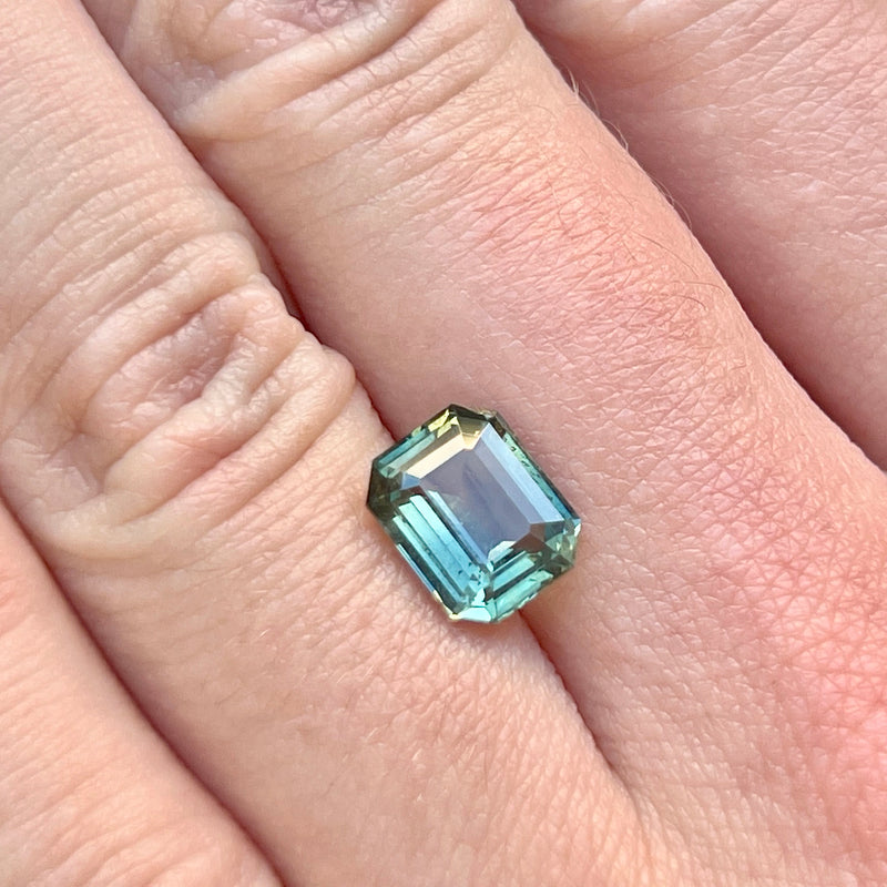 2.15CT EMERALD CUT MADAGASCAR SAPPHIRE, PARTI TEAL GREEN WITH YELLOW FLASHES, 8.22X6.58X3.73MM, UNTREATED