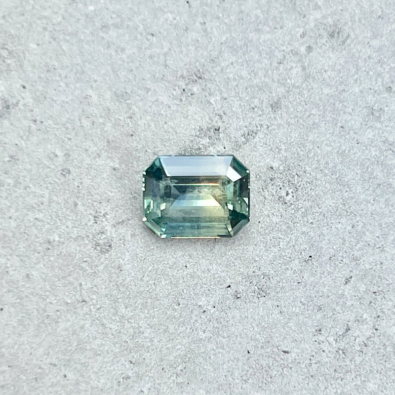 2.15CT EMERALD CUT MADAGASCAR SAPPHIRE, PARTI TEAL GREEN WITH YELLOW FLASHES, 8.22X6.58X3.73MM, UNTREATED