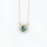 Madagascar Sapphire and diamond halo necklace in 14k gold